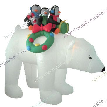 inflatable polar bear carrying penguins