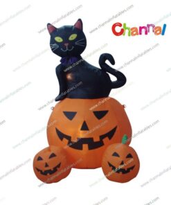 inflatable black cat sitting on pumpkings