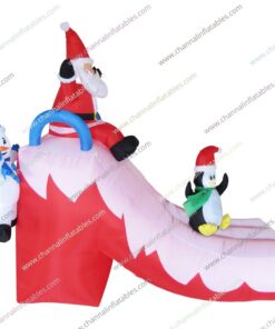 inflatable Santa penguin snowman playing slide