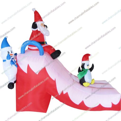 inflatable Santa penguin snowman playing slide
