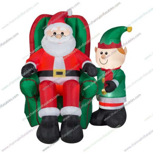 inflatable Santa in chair with elf