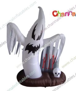 inflatable ghost next to grave