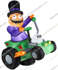 inflatable pumpkin man riding race car