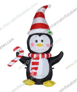 inflatable penguin with Santa hat and candy cane