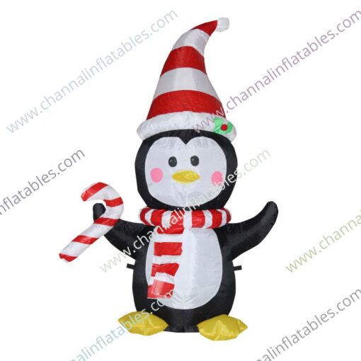 inflatable penguin with Santa hat and candy cane