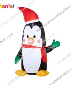 inflatable penguin with Santa hat and green mitten