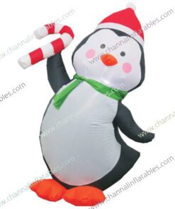 inflatable penguin holding candy cane