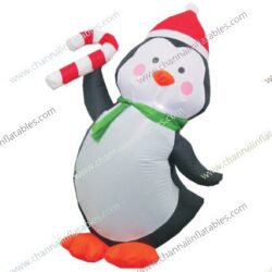 inflatable penguin holding candy cane