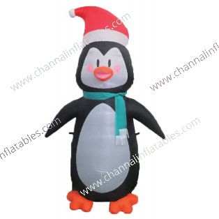 inflatable penguin with green scarf