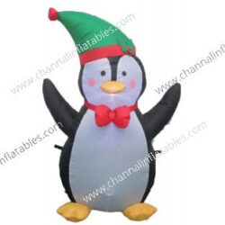inflatable penguin with green santa hat