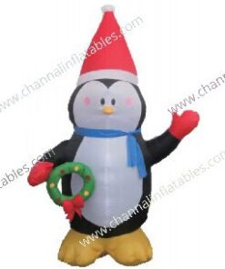 inflatable penguin holding wreath