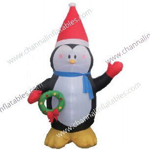 inflatable penguin holding wreath