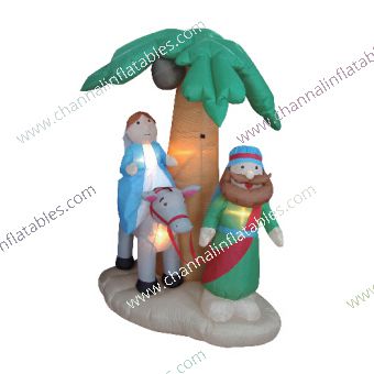 inflatable holy family under palm tree
