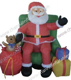 inflatable Santa sitting in chair