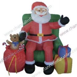 inflatable Santa sitting in chair