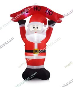 inflatable Santa holding ho sign