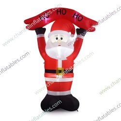 inflatable Santa holding ho sign