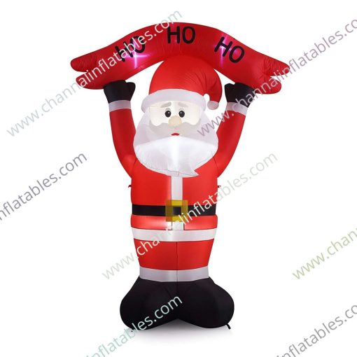 inflatable Santa holding ho sign