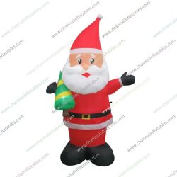 inflatable Santa holding little Christmas tree