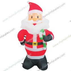 inflatable Santa Claus holding candy cane