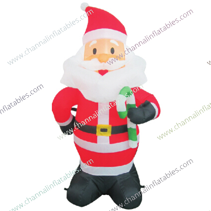 inflatable Santa Claus holding candy cane
