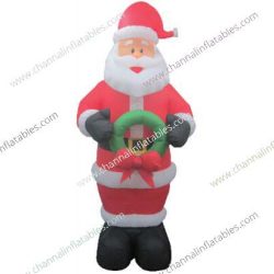 inflatable Santa holding wreath