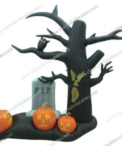 inflatable creepy tree in graveyard