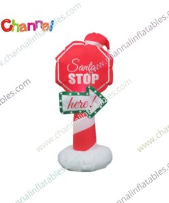 inflatable Santa stop here sign with Santa hat