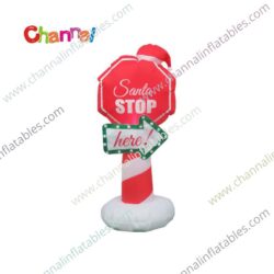 inflatable Santa stop here sign with Santa hat