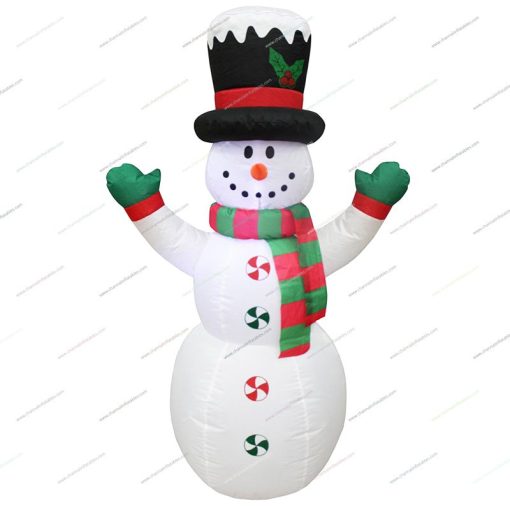 inflatable snowman with top hat covering snow