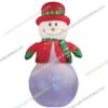 inflatable snowman with red hat and green scarf