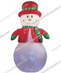 inflatable snowman with red hat and green scarf