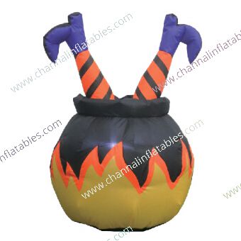 inflatable witch in cauldron