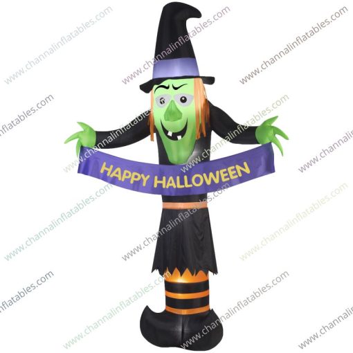 inflatable witch with happy Halloween banner